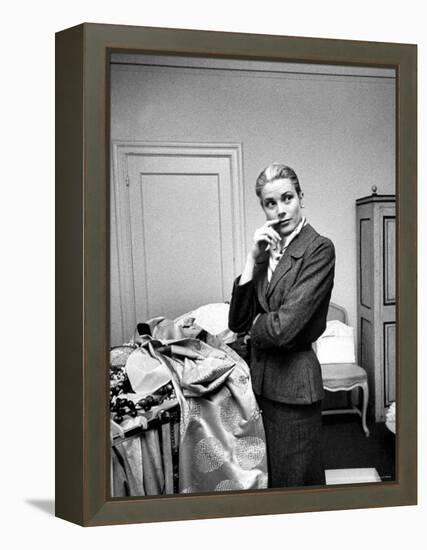 Actress Grace Kelly Packing Clothing Prior to Her Wedding to Prince Rainier-Lisa Larsen-Framed Premier Image Canvas