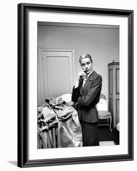 Actress Grace Kelly Packing Clothing Prior to Her Wedding to Prince Rainier-Lisa Larsen-Framed Premium Photographic Print