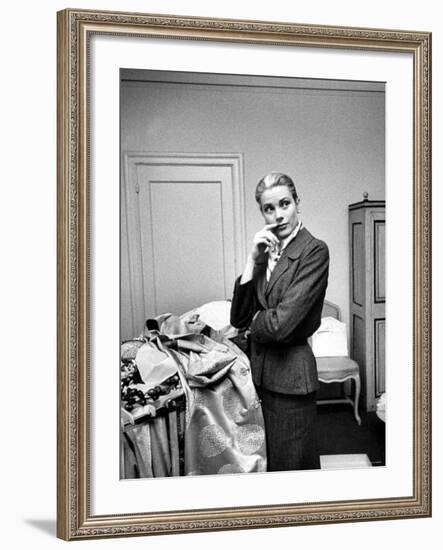 Actress Grace Kelly Packing Clothing Prior to Her Wedding to Prince Rainier-Lisa Larsen-Framed Premium Photographic Print