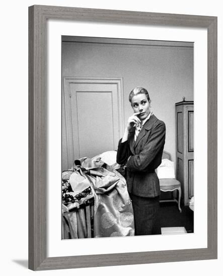 Actress Grace Kelly Packing Clothing Prior to Her Wedding to Prince Rainier-Lisa Larsen-Framed Premium Photographic Print