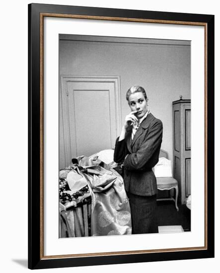 Actress Grace Kelly Packing Clothing Prior to Her Wedding to Prince Rainier-Lisa Larsen-Framed Premium Photographic Print