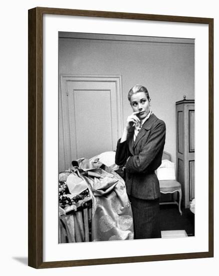 Actress Grace Kelly Packing Clothing Prior to Her Wedding to Prince Rainier-Lisa Larsen-Framed Premium Photographic Print