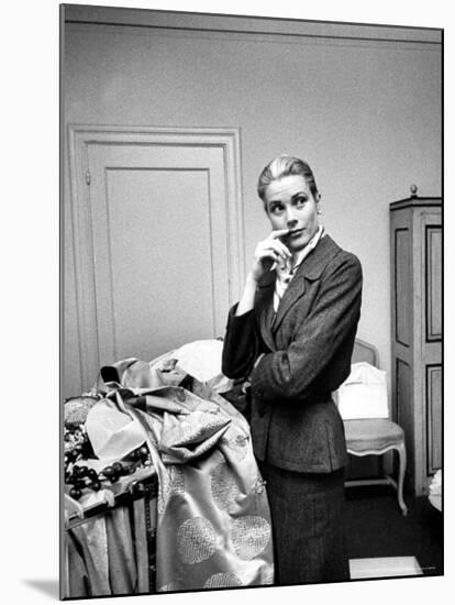 Actress Grace Kelly Packing Clothing Prior to Her Wedding to Prince Rainier-Lisa Larsen-Mounted Premium Photographic Print