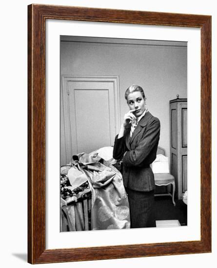 Actress Grace Kelly Packing Clothing Prior to Her Wedding to Prince Rainier-Lisa Larsen-Framed Premium Photographic Print