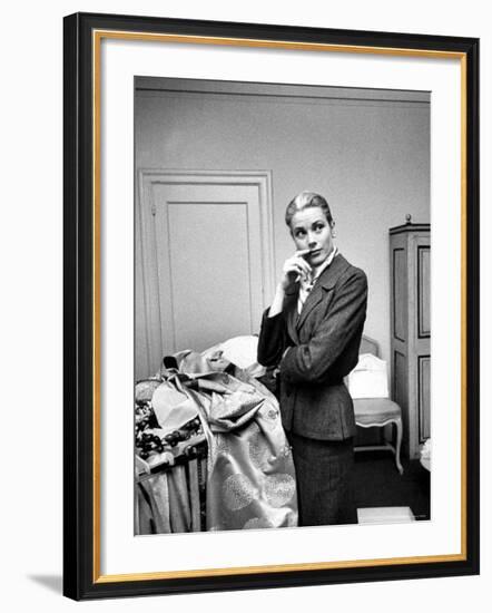 Actress Grace Kelly Packing Clothing Prior to Her Wedding to Prince Rainier-Lisa Larsen-Framed Premium Photographic Print