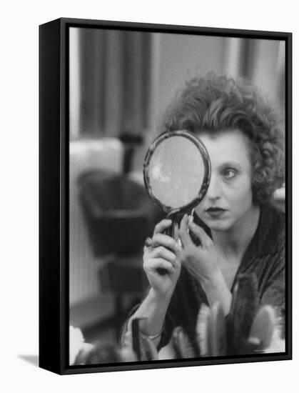 Actress Hanna Schygulla Looking in Hand Mirror While Applying Makeup-Alfred Eisenstaedt-Framed Premier Image Canvas