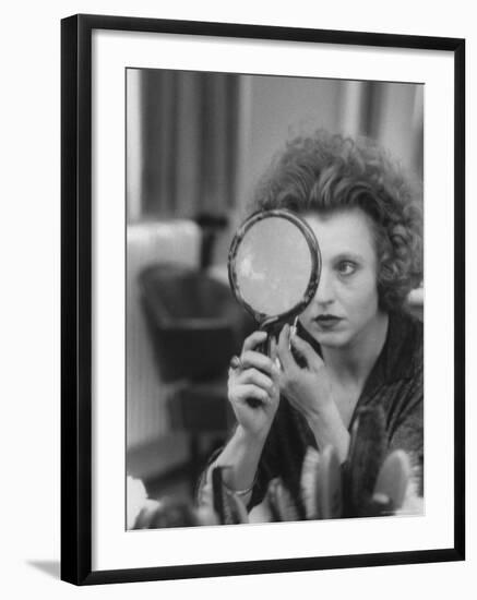 Actress Hanna Schygulla Looking in Hand Mirror While Applying Makeup-Alfred Eisenstaedt-Framed Premium Photographic Print