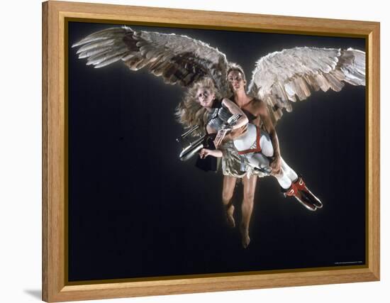 Actress Jane Fonda Being Carried by Guardian Angel in a Scene from Roger Vadim's Film "Barbarella"-Carlo Bavagnoli-Framed Premier Image Canvas