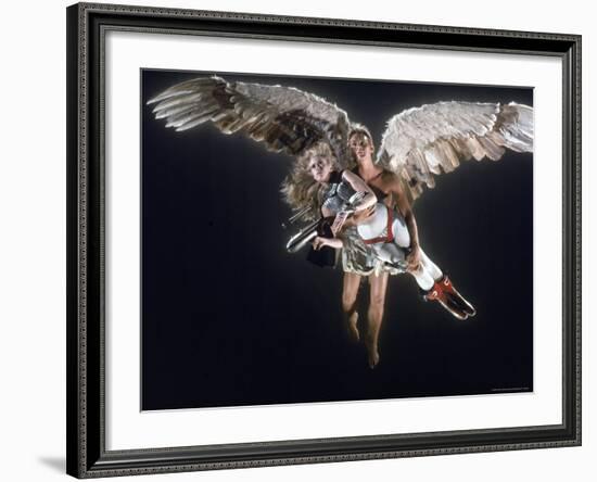 Actress Jane Fonda Being Carried by Guardian Angel in a Scene from Roger Vadim's Film "Barbarella"-Carlo Bavagnoli-Framed Premium Photographic Print