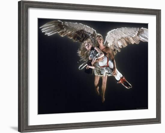 Actress Jane Fonda Being Carried by Guardian Angel in a Scene from Roger Vadim's Film "Barbarella"-Carlo Bavagnoli-Framed Premium Photographic Print