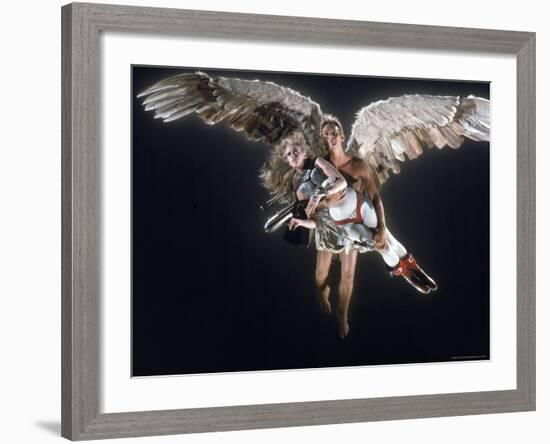 Actress Jane Fonda Being Carried by Guardian Angel in a Scene from Roger Vadim's Film "Barbarella"-Carlo Bavagnoli-Framed Premium Photographic Print