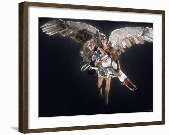 Actress Jane Fonda Being Carried by Guardian Angel in a Scene from Roger Vadim's Film "Barbarella"-Carlo Bavagnoli-Framed Premium Photographic Print