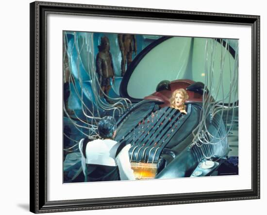 Actress Jane Fonda trapped in Machine which kills during scene from Roger Vadim's "Barbarella"-Carlo Bavagnoli-Framed Premium Photographic Print