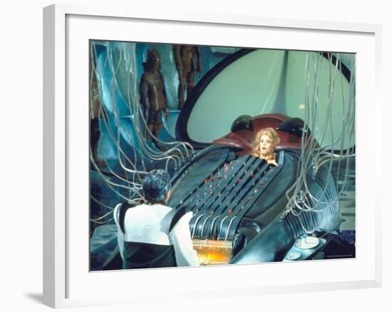 Actress Jane Fonda trapped in Machine which kills during scene from Roger Vadim's "Barbarella"-Carlo Bavagnoli-Framed Premium Photographic Print