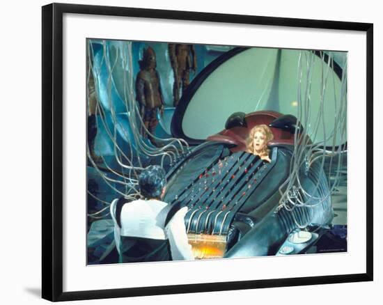 Actress Jane Fonda trapped in Machine which kills during scene from Roger Vadim's "Barbarella"-Carlo Bavagnoli-Framed Premium Photographic Print