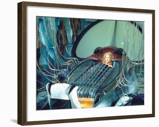 Actress Jane Fonda trapped in Machine which kills during scene from Roger Vadim's "Barbarella"-Carlo Bavagnoli-Framed Premium Photographic Print