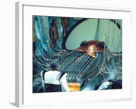 Actress Jane Fonda trapped in Machine which kills during scene from Roger Vadim's "Barbarella"-Carlo Bavagnoli-Framed Premium Photographic Print