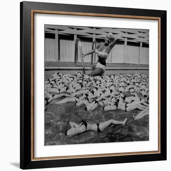 Actress Jayne Mansfield Posing with Shaped Hot Water Bottles Floating around Her at Her Pool-Allan Grant-Framed Premium Photographic Print