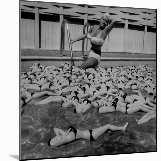 Actress Jayne Mansfield Posing with Shaped Hot Water Bottles Floating around Her at Her Pool-Allan Grant-Mounted Premium Photographic Print