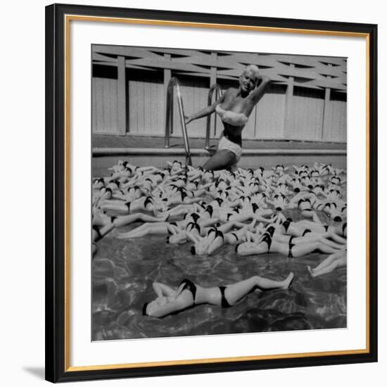 Actress Jayne Mansfield Posing with Shaped Hot Water Bottles Floating around Her at Her Pool-Allan Grant-Framed Premium Photographic Print