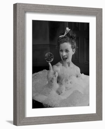 Actress Jeanne Crain Taking Bubble Bath for Her Role in Movie "Margie"-Peter Stackpole-Framed Premium Photographic Print