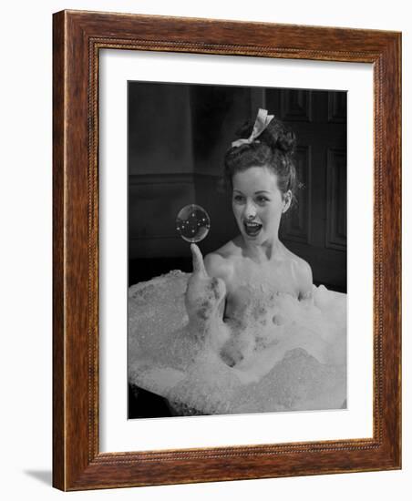 Actress Jeanne Crain Taking Bubble Bath for Her Role in Movie "Margie"-Peter Stackpole-Framed Premium Photographic Print