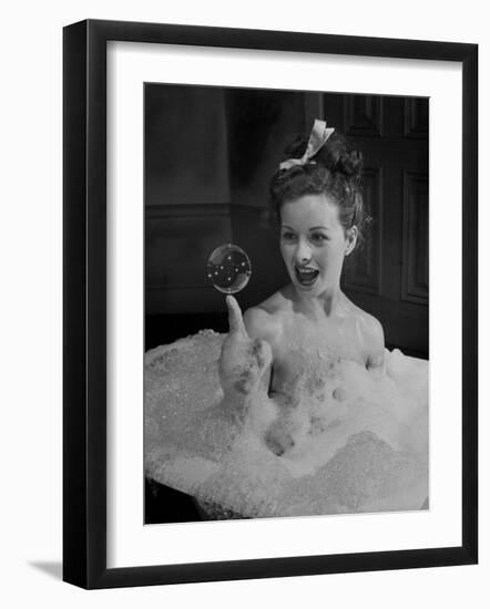 Actress Jeanne Crain Taking Bubble Bath for Her Role in Movie "Margie"-Peter Stackpole-Framed Premium Photographic Print