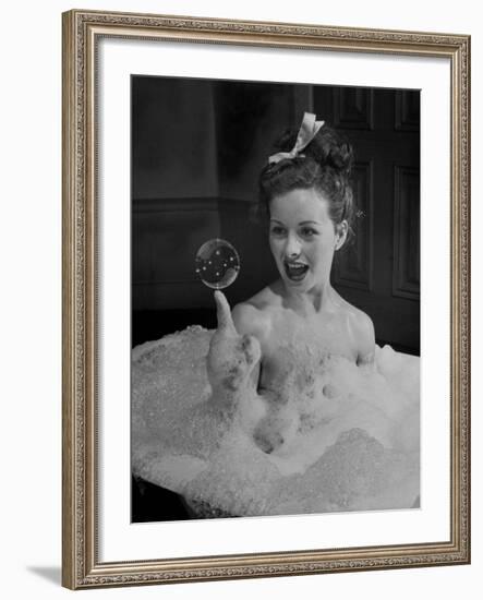 Actress Jeanne Crain Taking Bubble Bath for Her Role in Movie "Margie"-Peter Stackpole-Framed Premium Photographic Print