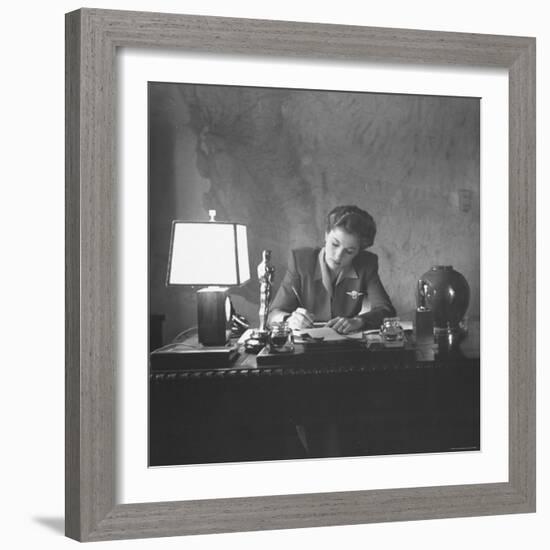 Actress Joan Fontaine Doing the Household Bookkeeping Next to Oscar Statuette-Bob Landry-Framed Premium Photographic Print