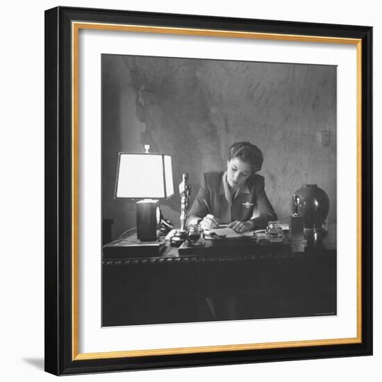 Actress Joan Fontaine Doing the Household Bookkeeping Next to Oscar Statuette-Bob Landry-Framed Premium Photographic Print