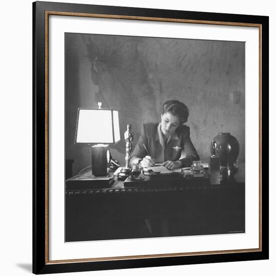 Actress Joan Fontaine Doing the Household Bookkeeping Next to Oscar Statuette-Bob Landry-Framed Premium Photographic Print