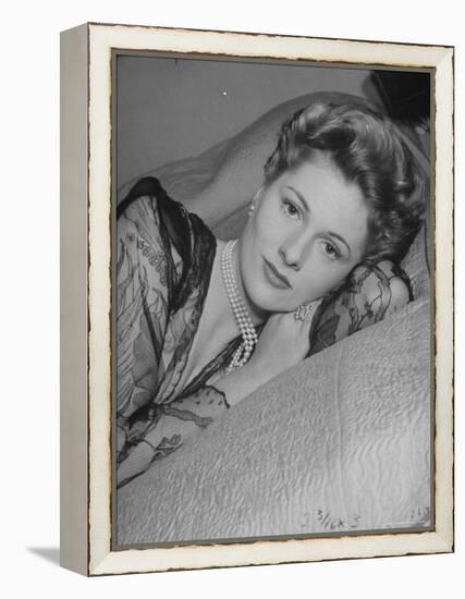 Actress Joan Fontaine Wearing Sheer Negligee While Lounging on Bed at Home-Bob Landry-Framed Premier Image Canvas