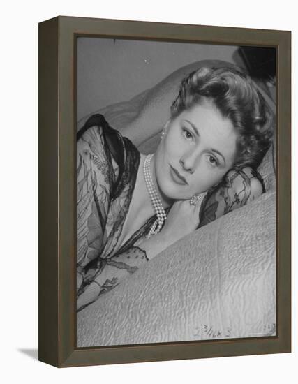 Actress Joan Fontaine Wearing Sheer Negligee While Lounging on Bed at Home-Bob Landry-Framed Premier Image Canvas