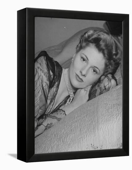 Actress Joan Fontaine Wearing Sheer Negligee While Lounging on Bed at Home-Bob Landry-Framed Premier Image Canvas