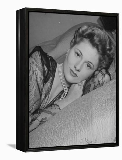 Actress Joan Fontaine Wearing Sheer Negligee While Lounging on Bed at Home-Bob Landry-Framed Premier Image Canvas