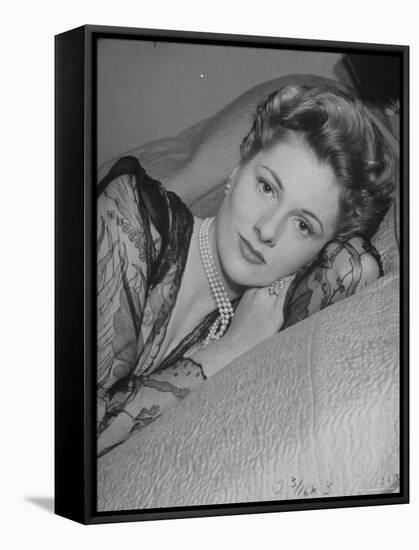 Actress Joan Fontaine Wearing Sheer Negligee While Lounging on Bed at Home-Bob Landry-Framed Premier Image Canvas