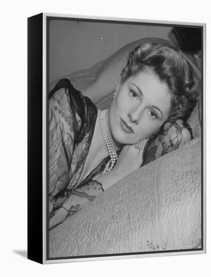 Actress Joan Fontaine Wearing Sheer Negligee While Lounging on Bed at Home-Bob Landry-Framed Premier Image Canvas