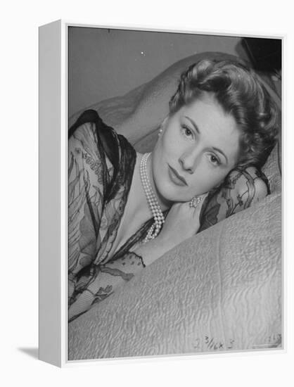 Actress Joan Fontaine Wearing Sheer Negligee While Lounging on Bed at Home-Bob Landry-Framed Premier Image Canvas
