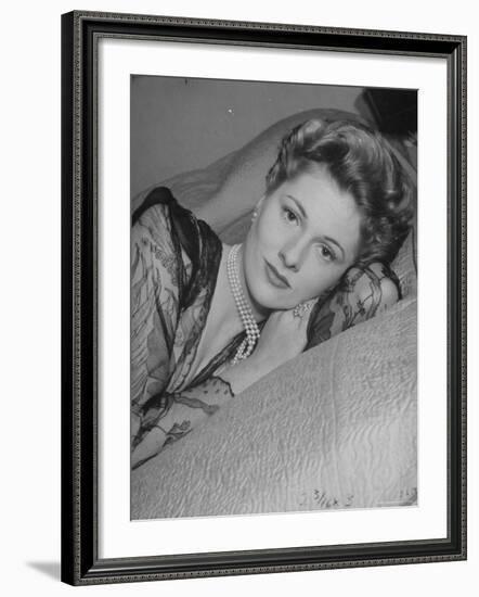 Actress Joan Fontaine Wearing Sheer Negligee While Lounging on Bed at Home-Bob Landry-Framed Premium Photographic Print