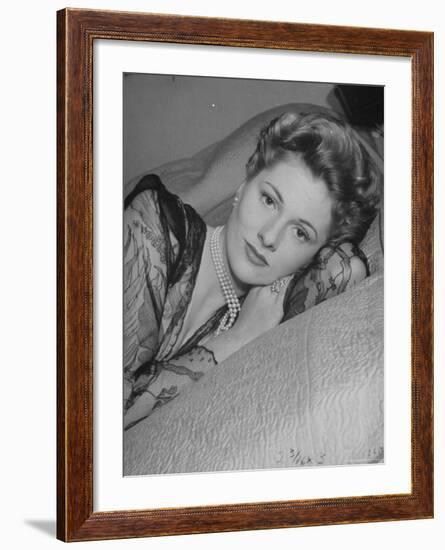 Actress Joan Fontaine Wearing Sheer Negligee While Lounging on Bed at Home-Bob Landry-Framed Premium Photographic Print