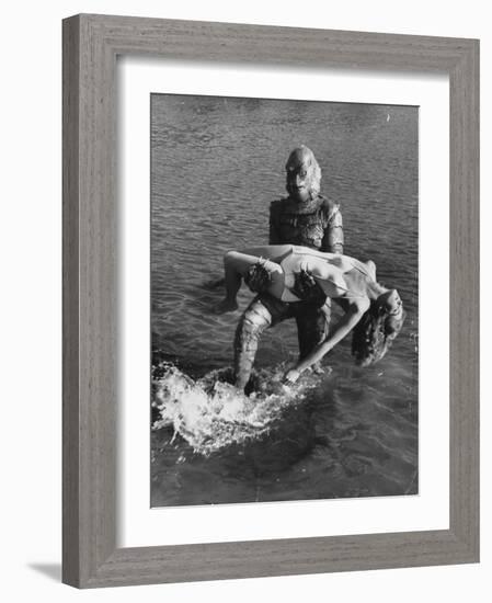 Actress Julia Adams is Carried by Monster, Gill Man, in the Movie, Creature from the Black Lagoon-Ed Clark-Framed Premium Photographic Print