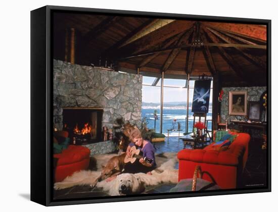 Actress Kim Novak Playing Guitar Beside Pet Great Dane Warlock at Her Home in Big Sur-Eliot Elisofon-Framed Premier Image Canvas