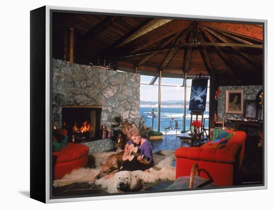 Actress Kim Novak Playing Guitar Beside Pet Great Dane Warlock at Her Home in Big Sur-Eliot Elisofon-Framed Premier Image Canvas