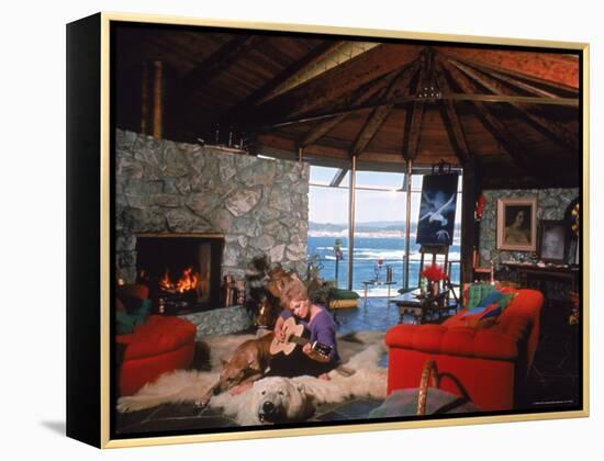 Actress Kim Novak Playing Guitar Beside Pet Great Dane Warlock at Her Home in Big Sur-Eliot Elisofon-Framed Premier Image Canvas