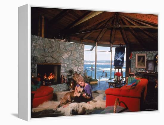 Actress Kim Novak Playing Guitar Beside Pet Great Dane Warlock at Her Home in Big Sur-Eliot Elisofon-Framed Premier Image Canvas