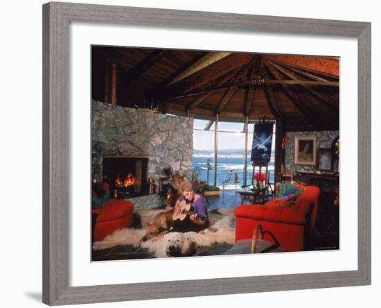 Actress Kim Novak Playing Guitar Beside Pet Great Dane Warlock at Her Home in Big Sur-Eliot Elisofon-Framed Premium Photographic Print