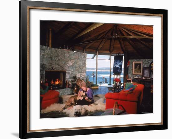 Actress Kim Novak Playing Guitar Beside Pet Great Dane Warlock at Her Home in Big Sur-Eliot Elisofon-Framed Premium Photographic Print