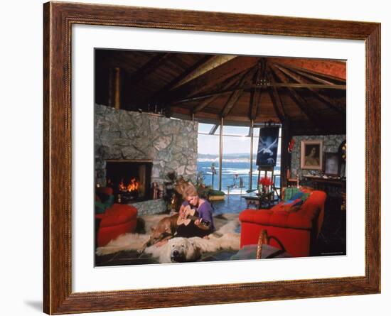 Actress Kim Novak Playing Guitar Beside Pet Great Dane Warlock at Her Home in Big Sur-Eliot Elisofon-Framed Premium Photographic Print