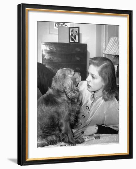 Actress Lauren Bacall Chatting with Her Cocker Spaniel Dog in Her Suite at Gotham Hotel-Nina Leen-Framed Premium Photographic Print