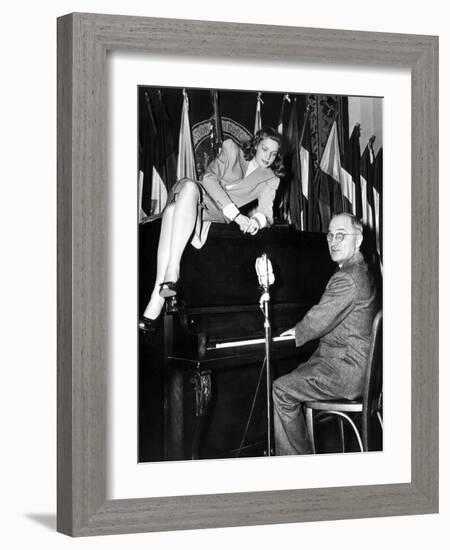 Actress Lauren Bacall Sits Atop the Piano While Vice President Harry Truman Plays-null-Framed Photo